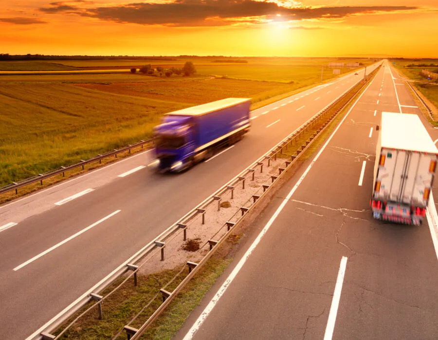 Blue and white truck in motion blur on the highway